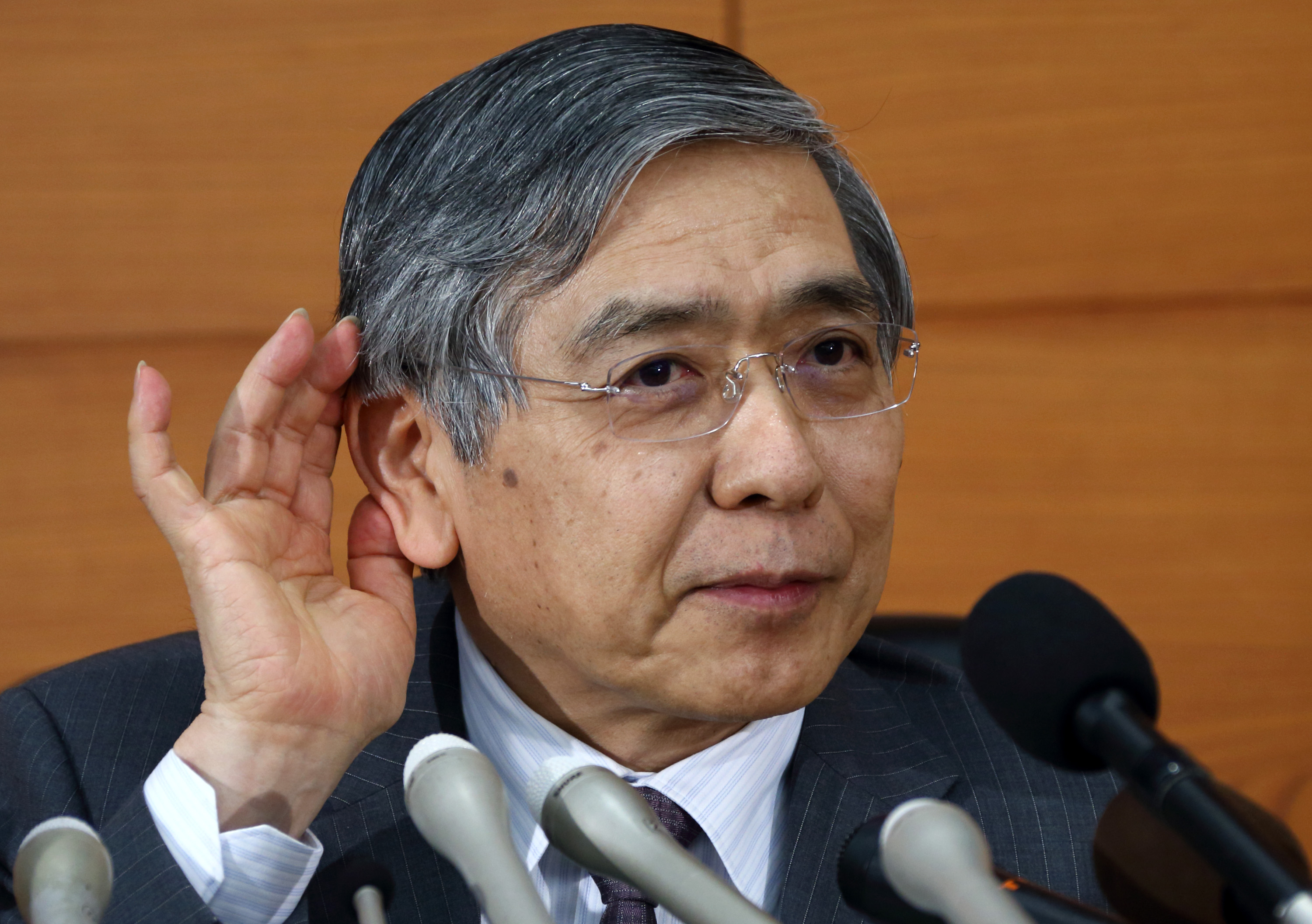 Bank of Japan Gov. Haruhiko Kuroda listens to a reporter during a news conference at the central bank's headquarters in Tokyo on April 30. | BLOOMBERG