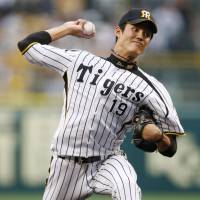 Stingy: Tigers right-hander Shintaro Fujinami holds the Marines to three hits in eight innings on Tuesday at Koshien Stadium. Hanshin beat Chiba Lotte 2-0. | KYODO