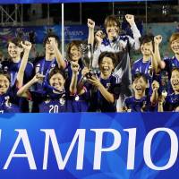 Nadeshiko Japan players celebrate with the Women\'s Asian Cup trophy after beating Australia 1-0 on Sunday night in Ho Chi Minh City to win the competition for the first time. Story: Page 14. | KYODO