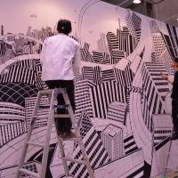A festival by design: Artists prepare a work for last year\'s Design Festa. | &#169; 2014 \"WOOD JOB!: KAMISARI NAANAA NICHIJO\" SEISAKU IINKAI