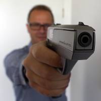 An Armatix smart gun is demonstrated at the company\'s Munich headquarters Wednesday. The gun cannot fire without an ID device worn by the user. Following a ferocious backlash, a Maryland gun store has dropped plans to become the first in the U.S. to sell the gun. | REUTERS