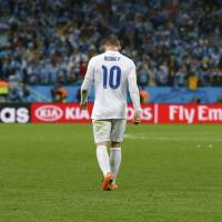 Disappointing defeat: England\'s Wayne Rooney walks off the pitch after their Group D match against Uruguay on Thursday.
 | REUTERS