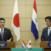 Paraguay\'s President Horacio Cartes speaks as Prime Minister Shinzo Abe looks on during their joint news conference following their meeting at the prime minister\'s official residence in Tokyo on Wednesday. | AP