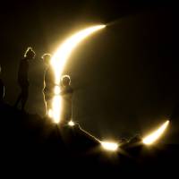 People watch an annular eclipse from Phoenix, Arizona, in May 2012. The event, also known as a “Ring of Fire Eclipse,” was visible in wide areas across Japan, China and elsewhere in the Asia-Pacific region before moving across the ocean to become visible in parts of the western United States.  | AP