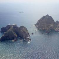 These disputed rocks off Shimane Prefecture are claimed by Japan but controlled by South Korea. | KYODO