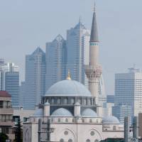 Spiritual center: The Tokyo Camii mosque in Yoyogi-Uehara, Shibuya Ward, was established in 1938 and rebuilt in 2000, using marble imported from Turkey. During the month of Ramadan, food is served here for the breaking of the fast. | COURTESY OF TOKYO CAMII