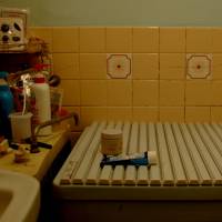 Daily ablutions: A bathroom somewhere in Tokyo bathes in glorious artificial light. | HIDE ISHIDA