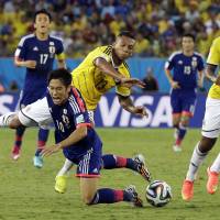 Back to the drawing board: Japan\'s Shinji Kagawa (10) and his teammates didn\'t rise to the occasion at the World Cup in Brazil.  | AP