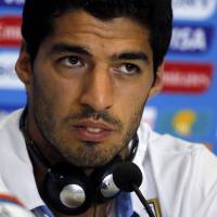 Insincere: Uruguay striker Luis Suarez was suspended for four months by FIFA for biting Italy\'s Giorgio Chiellini in a first-round match on Tuesday. | REUTERS
