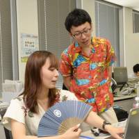 Public servants at the Environment Ministry go casual Monday to kick off this year\'s Super Cool Biz energy-saving campaign. | KYODO