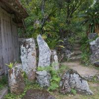 Tranquil retreat: Seasoned wood and weathered stone create sense of antiquity at Miyara Dunchi, a traditional garden in Okinawa that has survived nearly 200 years of history. | STEPHEN MANSFIELD