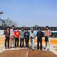 Yoshihiko Kichikawa (left), Shunsuke Mizuno (second from left) and Koshi Takatsu (fourth from left) pose with other members of the Japanese International Student Society in front of plastic bags filled with radiation-tainted soil at Joenji Temple in Fukushima Prefecture. | KOSHI TAKATSU