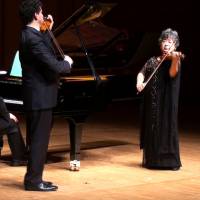Yuriko Kuronuma plays with her former student &#8212; world famous violinist Adrian Justus &#8212; and pianist Rafael Guerra at a concert in Tokyo in January 2013. | COURTESY OF YURIKO KURONUMA