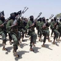 Newly trained al-Shabab fighters perform military exercises south of the Somali capital, Mogadishu, in February 2011. AP Kenyan president blames locals for slaughter