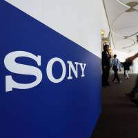 Sony Corp. shareholders arrive for the loss-making company\'s annual general meeting in Tokyo on Thursday. | BLOOMBERG
