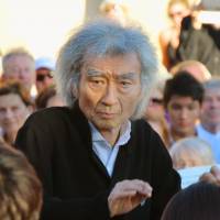 Seiji Ozawa conducts young string players Thursday in Rolle, Switzerland, in his first international appearance in three years or so. | KYODO