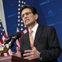 Following his defeat in the Virginia primary Tuesday, House Majority Leader Eric Cantor tells reporters at the Capitol in Washington on Wednesday that he intends to resign his leadership post at the end of July. Cantor lost to tea party challenger David Brat, who campaigned on a platform of opposition to loosening immigration laws. | AP