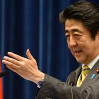 Prime Minister Shinzo Abe speaks during a news conference at his office in Tokyo on Tuesday. | AFP-JIJI