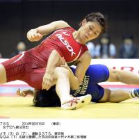 Victorious effort: Three-time Olympic gold medalist Saori Yoshida grabs the 53-kg division title at the National Invitational Championships on Sunday in Tokyo.  | KYODO
