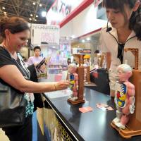 Christmas in June: Visitors check out the thousands of new toys, gadgets and games at the International Tokyo Toy Show on Thursday. | YOSHIAKI MIURA