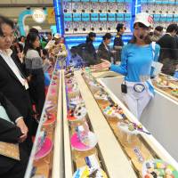 Christmas in June: Visitors check out the thousands of new toys, gadgets and games at the International Tokyo Toy Show on Thursday. | YOSHIAKI MIURA