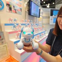 Christmas in June: Visitors check out the thousands of new toys, gadgets and games at the International Tokyo Toy Show on Thursday. | YOSHIAKI MIURA
