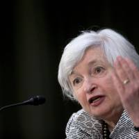 Janet Yellen, chair of the U.S. Federal Reserve, speaks Tuesday during a Senate Banking Committee hearing in Washington. Yellen told lawmakers the central bank must press on with monetary stimulus as \"significant slack\" remains in labor markets and inflation is still below the Fed\'s goal. | BLOOMBERG