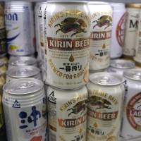 Kirin Ichiban Shibori beers (center) are placed in a fridge at a Tokyo store Thursday. | REUTERS