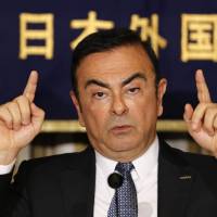 Nissan Motor Corp. chief Carlos Ghosn speaks at the Foreign Correspondents\' Club of Japan in Tokyo on Thursday. | REUTERS