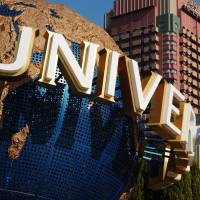 The Universal Studios logo anchors the entrance to Universal Studios Japan in Osaka. The theme park is reportedly considering bidding for a license to operate a casino complex if gambling regulations are eased. | BLOOMBERG