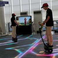 Toyota\'s staff demonstrate a Winglet at Mega Web in Odaiba, Tokyo.  SATOKO KAWASAKI | BLOOMBERG