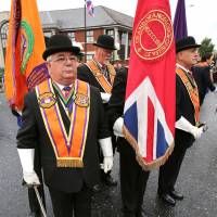 Protestant Orangemen march in Belfast on Saturday. | AFP