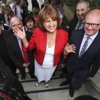 The new leader of the Irish Labour Party, Joan Burton, arrives at the Mansion House in Dublin following the ballot count for the leadership elections on Friday. | AP