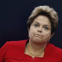 Brazil President Dilma Rousseff reacts during a news conference in Brasilia on the 2014 World Cup on July 14. | REUTERS