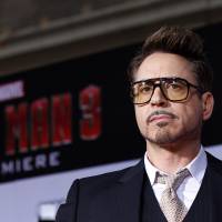 Cast member Robert Downey Jr. poses at the premiere of \"Iron Man 3\" at the El Capitan theater in Hollywood, California, on April 24, 2013, The star of Disney\'s Marvel superhero film franchises \"Iron Man\" and \"The Avengers\" is Hollywood\'s highest-paid actor for the second consecutive year, with estimated earnings of $75 million, Forbes.com, said Monday. | REUTERS