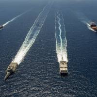 The U.S. Navy San Antonio-class amphibious transport dock ship USS Anchorage, the littoral combat ship USS Coronado, the joint high speed vessel USNS Millinocket and the Military Sealift Command mobile-landing platform USNS Montford Point take part in the U.S.-led Rimpac naval drills July 11 off the coast of Southern California. | AFP