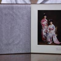 Misa Morimoto, the 50-year-old identical twin of Miho Yamamoto, shows a photograph of Miho (standing) and herself in kimono on their 20th birthday in 1984, during an interview in Otsuki, Yamanashi Prefecture, on July 15. | REUTERS