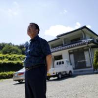 Mikio Watanabe\'s house in Kawamata, Fukushima Prefecture, remains radioactive and all he can do is maintain it during short visits. Being unemployed and forced to live elsewhere was too much for his wife, who burned herself to death during what she thought would be their final stay at the house. | REUTERS