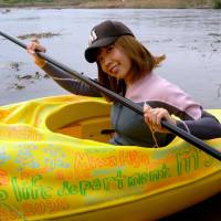 Artist Megumi Igarashi paddles a kayak designed to be the shape of her own vagina in Tokyo, in a photo reportedly taken on Oct. 19.  | AFP-JIJI/ROKUDENASHI-KO AND MARIE AKATANI