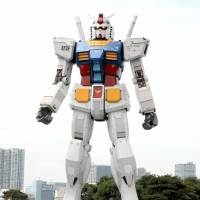A life-sized Gundam figure stands in Tokyo\'s Odaiba district, seen here at an event on Aug. 21, 2009, to commemorate the 30th anniversary of the animated TV series. | YOSHIAKI MIURA