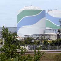 Reactors 1 and 2 at the Sendai nuclear power station in Satsumasendai, Kagoshima Prefecture, lie idle July 8. The two units are likely to be the first in the nation to be reactivated under new safety regulations introduced since the 2011 Fukushima nuclear crisis. | KYODO