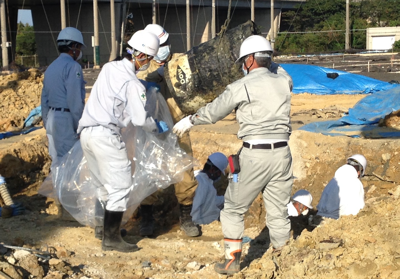 Excavation of the former U.S. military dump in January uncovered 61 barrels, some of which bore markings of the Dow Chemical Company. | NAOYA KUWAE