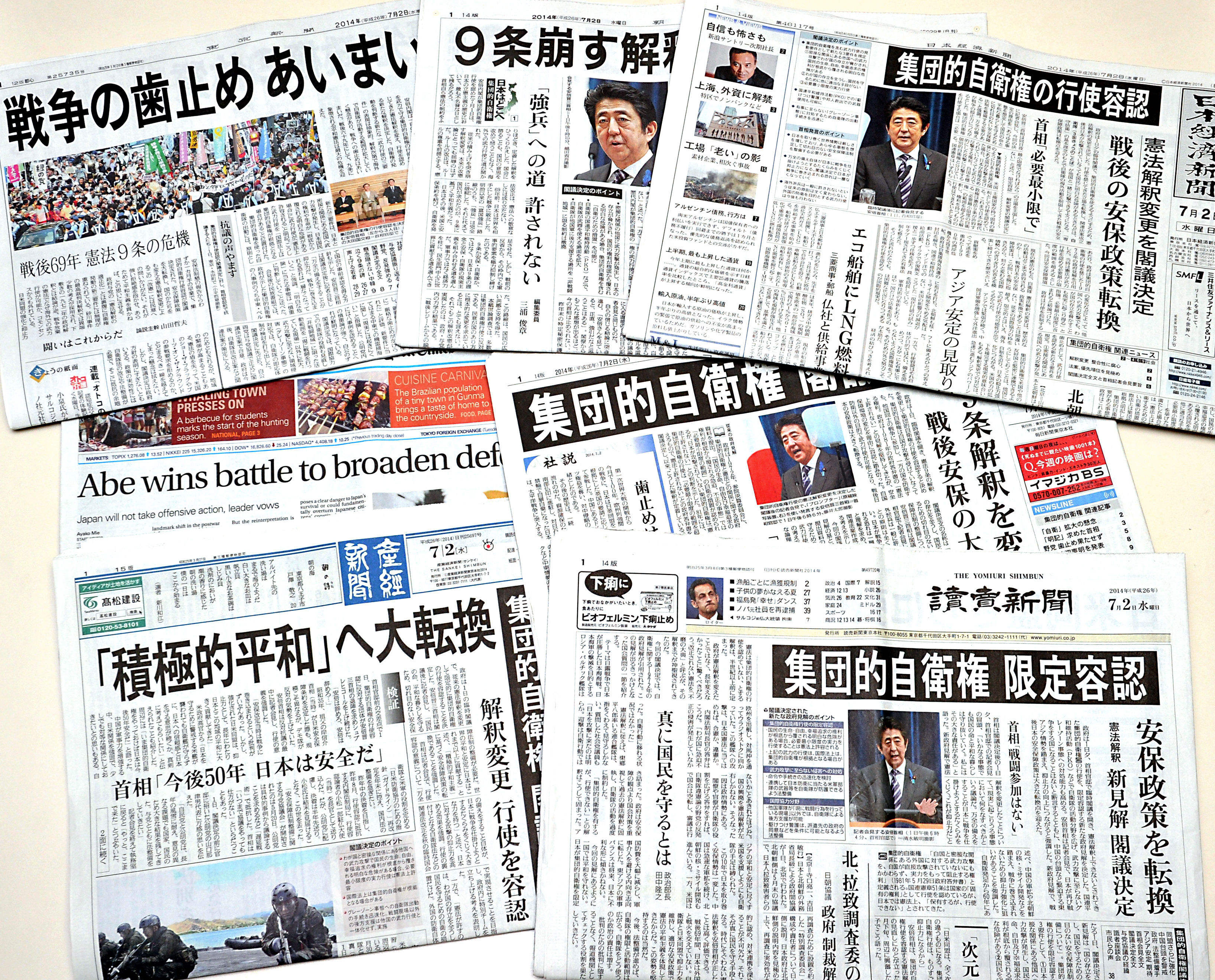 A selection of dailies on July 2 show headlines reporting the Cabinet decision to effectively lift Japan's self-imposed ban on exercising the right to collective self-defense. | YOSHIAKI MIURA