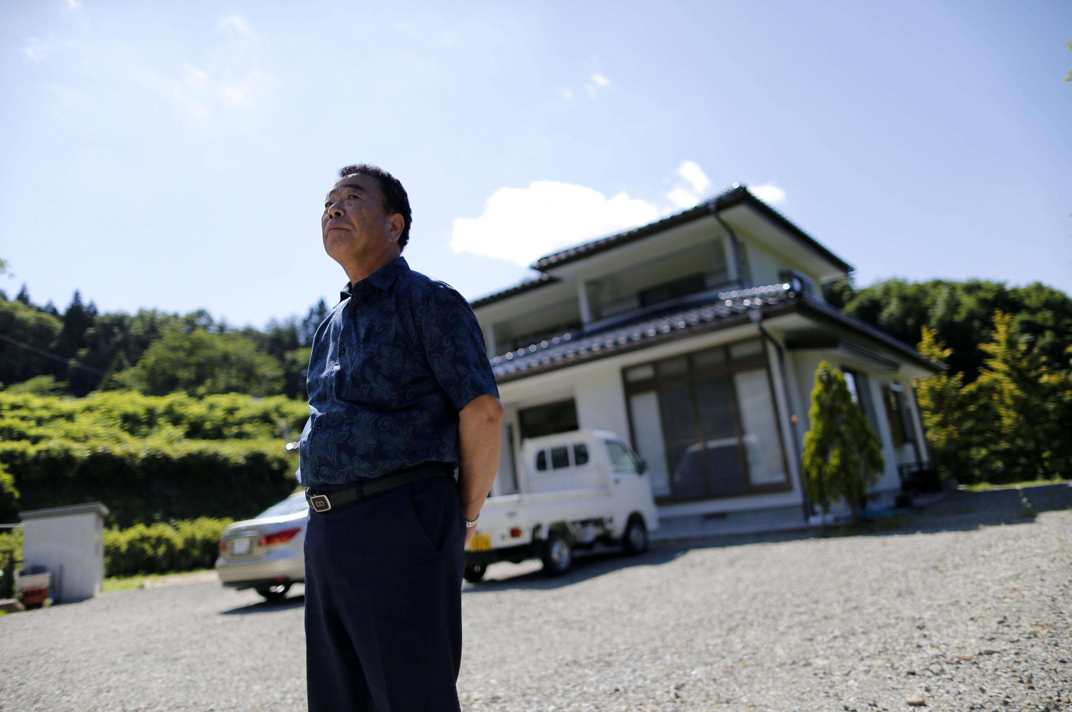 Mikio Watanabe's house in Kawamata, Fukushima Prefecture, remains in an exclusion zone and all he can do is maintain it during short visits. Being unemployed and forced to live elsewhere was too much for his wife, who burned herself to death during what she thought would be their final stay at the house. | REUTERS