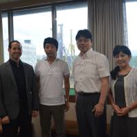Left to right: Matthew Cook, senior staff with the Education Innovation Group\'s General Affairs and Planning Division in Osaka Prefecture; Toru Nakahara, superintendent of the prefectural board of education; and Nobuteru Ikeshima and Hiroko Aoki, senior staffers with the High School Division of the Educational Affairs Section.  | J.J. O\'DONOGHUE