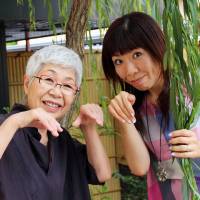 Junko Tsuchiya and her daughter, Satoe Tsugita, under a willow tree. | KIT NAGAMURA