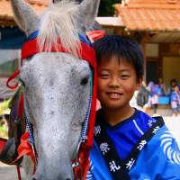 Horse whisperer: A young boy in Yabusame, with the white steed that will be used in an archery festival. | ANGELES MARIN CABELLO
