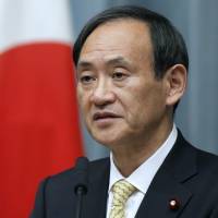 In the hot seat: Chief Cabinet Secretary Yoshihide Suga speaks at a news conference in Tokyo in 2012. The murky call on a hardball interview with Chief Cabinet Secretary Suga