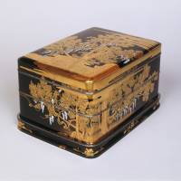 A tiered inkstone box with a Maki-e (gold powder) lacquer design of cedars and wisterias (1920) by Shuetsu Koda. Lacquerware's overseas journey into the arts