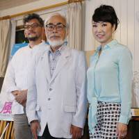Film director Hideaki Anno (left), animator Hayao Miyazaki (center) and singer Yumi Matsutoya attend a press conference on the completion of Miyazaki\'s new animation film \"Kaze Tachinu\" at Studio Ghibli in Koganei, Tokyo, on June 24, 2013. | KYODO